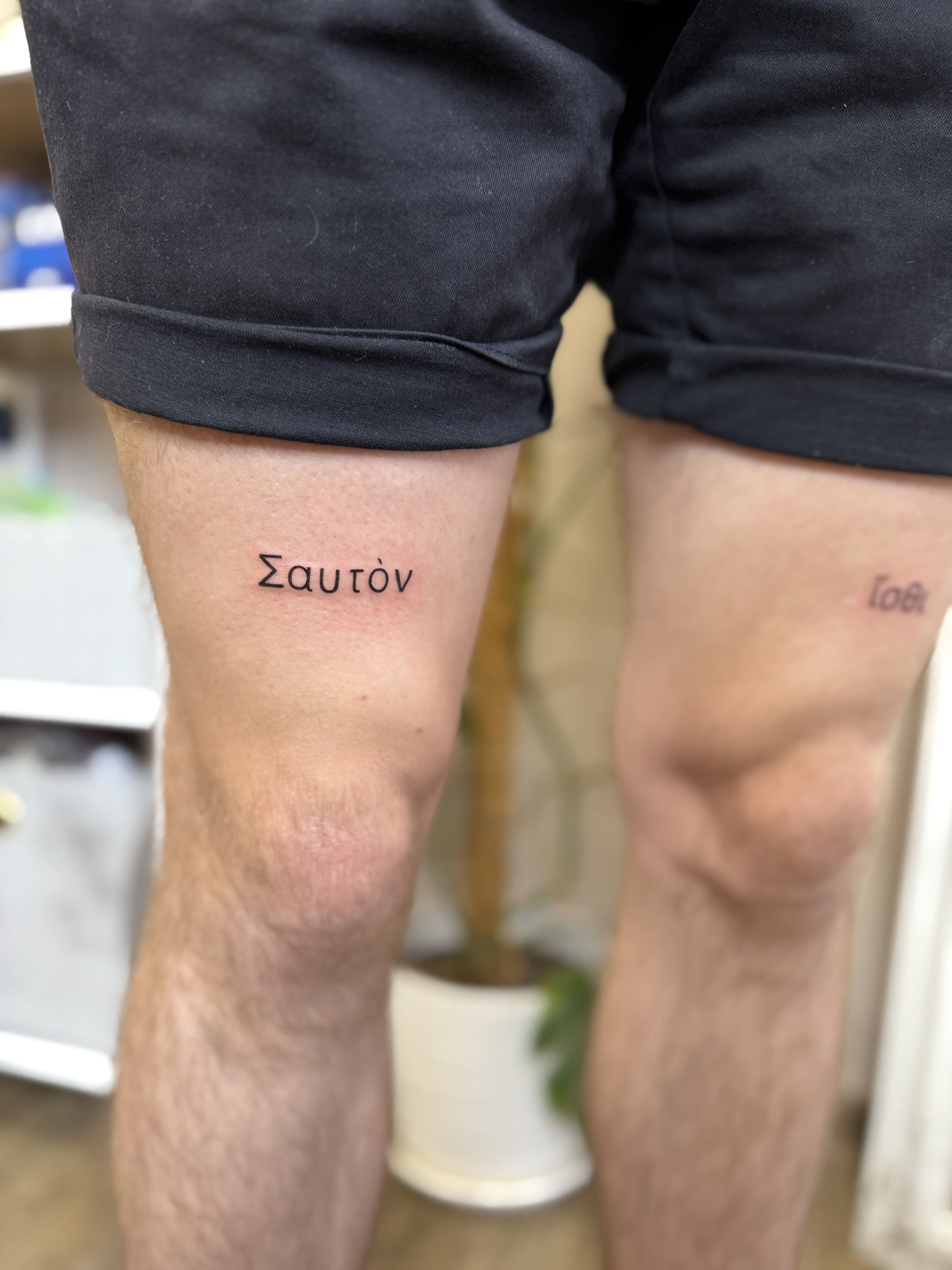 Тату грецький текст, обидва стегна / Greek text tattoo, both thighs